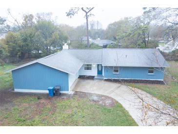 Charming single Gathering home featuring two-car garage and well manicured lawn at 20004 Harvie Ln, Lutz, FL 33558
