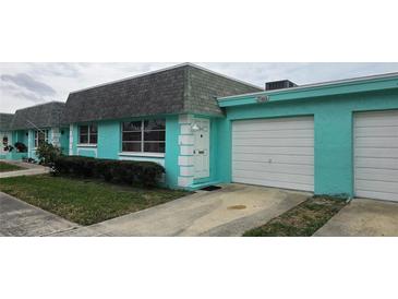 Charming townhome featuring a private entrance, attached garage, and well-maintained landscaping at 7060 Lafayette St # 7060, Pinellas Park, FL 33781
