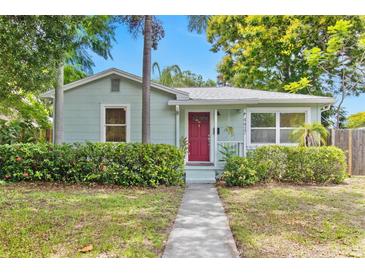 Charming single-story home with a well-maintained lawn and vibrant red front door at 4417 7Th N Ave, St Petersburg, FL 33713