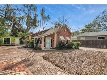 Charming brick home featuring a brick driveway and inviting curb appeal, perfect for a cozy residence at 1105 E 33Rd Ave, Tampa, FL 33603