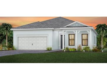 Beautiful single-Gathering home featuring a two-car garage and a well-manicured lawn at 19410 Indian Rock Pl, Lakewood Ranch, FL 34211