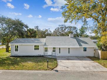 Charming single story home with a well-maintained lawn and freshly painted exterior at 2530 Sunset Dr, Largo, FL 33770