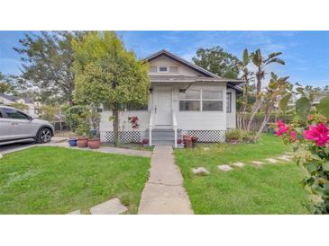 Charming single-Gathering home features a well-maintained lawn and cozy porch at 4804 N 10Th St, Tampa, FL 33603