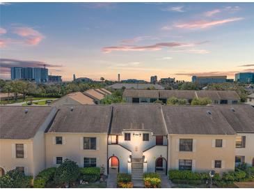 Charming townhomes boast well-maintained lawns and inviting architecture at 2462 Kingfisher Ln # J203, Clearwater, FL 33762