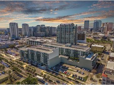 Stunning aerial view of a modern apartment complex nestled in a vibrant cityscape under a beautiful sky at 111 N 12Th St # 1314, Tampa, FL 33602
