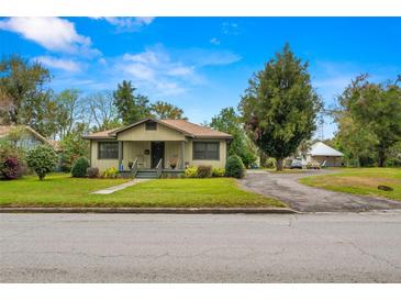 Charming single-story home with landscaped front yard and welcoming porch at 37713 Florida Ave, Dade City, FL 33525