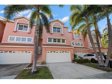 Charming townhouse featuring a two-car garage and well-maintained landscaping in a desirable neighborhood at 14584 El Paseo Dr, Seminole, FL 33776