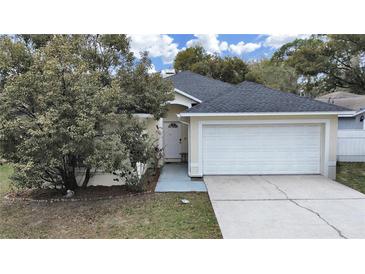 Charming single-Gathering home with a well-maintained lawn and two car garage at 6512 N 24Th St, Tampa, FL 33610