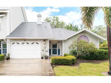 Charming single-story home with well-maintained landscaping and attached garage at 11722 Currie Ln # G1, Largo, FL 33774