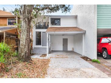 Charming townhome featuring a covered carport, and well-maintained landscaping at 2535 E Stanley Matthew Cir, Tampa, FL 33604