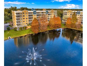 Scenic view of the apartment complex with a fountain in the foreground, showcasing the waterfront setting at 960 Starkey Rd # 3406, Largo, FL 33771