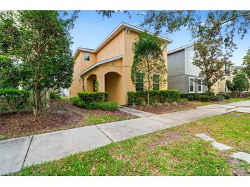 Charming two-story home featuring a welcoming entrance and well-maintained landscaping at 9033 Aspen Hollow Pl, Riverview, FL 33578