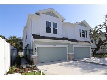 New construction townhome with two-car garage, and modern craftsman style at 3021 W Ballast Pt # 2, Tampa, FL 33611