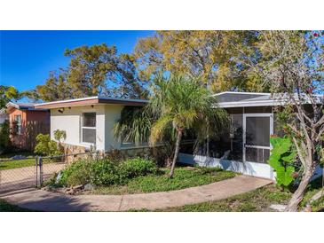 Charming single-story home with a well-maintained lawn and a cozy screened-in porch at 3501 Beechwood N Ter, Pinellas Park, FL 33781