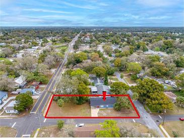 Aerial view of a charming home with a large lot and mature trees in a quiet neighborhood at 6232 Jackson St, New Port Richey, FL 34653
