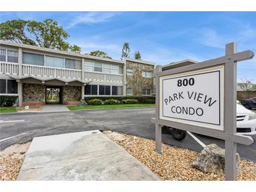 Exterior view of the Park View Condo building with a stone facade and well-maintained landscaping at 800 71St N Ave # 8, St Petersburg, FL 33702