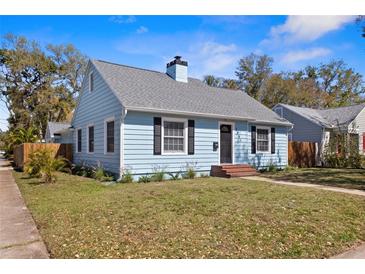 Charming light blue home featuring a cozy front yard and classic architectural details at 2951 7Th N Ave, St Petersburg, FL 33713