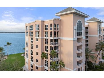 Stunning waterfront condo featuring private balconies, lush landscaping, and breathtaking water views at 4951 Bacopa S Ln # 801, St Petersburg, FL 33715