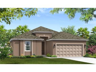 Charming single-story home featuring a two-car garage and nicely landscaped front yard at 12631 Kelly Ann Loop, Brooksville, FL 34613