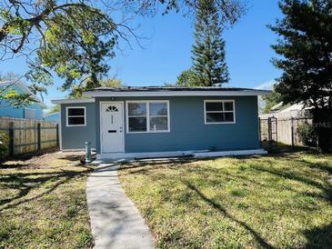 Charming single-story home with tidy front yard, walkway and mature trees at 3426 28Th N St, St Petersburg, FL 33713