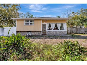 Charming one-story home with a large front window and stone accents at 4716 Gazania St, New Port Richey, FL 34652