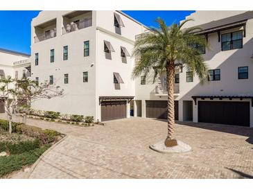 Charming townhouse with multiple garages and lush landscaping in a waterfront community at 188 Brightwater Dr # 2, Clearwater Beach, FL 33767