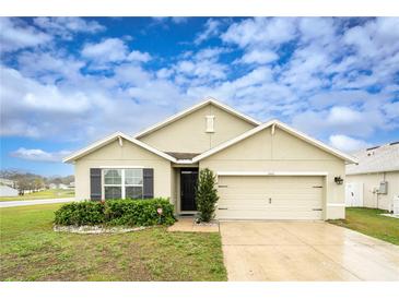 Charming single-Gathering home with a well-maintained lawn and a two-car garage, perfect for suburban living at 35661 Jenny Lynne Cir, Zephyrhills, FL 33541