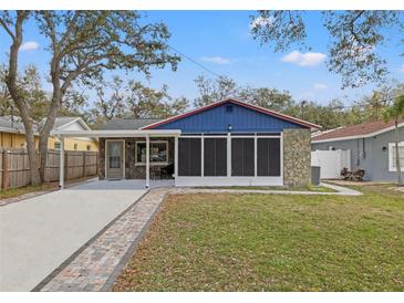 Charming single-story home with stone accents, well-manicured lawn, and covered parking at 7041 73Rd N St, Pinellas Park, FL 33781