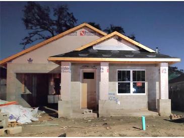 Image of a building under construction with visible roof framing and concrete block walls at 8111 N Edison Ave, Tampa, FL 33610
