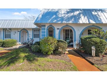 Charming villa featuring a well-maintained lawn and blue trim accents at 4222 Richmere Dr # 4222, New Port Richey, FL 34652