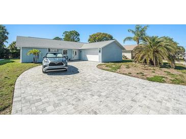 Charming home with a well-manicured lawn, a paved driveway and a one car garage at 4662 Dewey Dr, New Port Richey, FL 34652