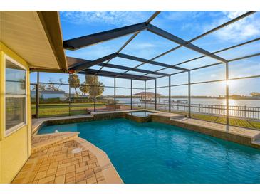 Screened-in pool and spa with lovely intercoastal views make for resort style living at 8841 W Millpoint Rd, Riverview, FL 33578