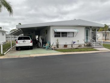 Charming single-story home with covered parking and an inviting entrance at 3301 Alt 19 # 700, Palm Harbor, FL 34683