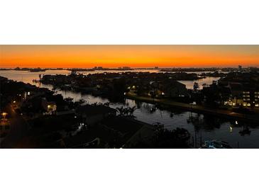 Scenic sunset view of the city skyline and waterways creates a tranquil and picturesque ambiance at 5950 Pelican Bay S Plz # 1104, Gulfport, FL 33707