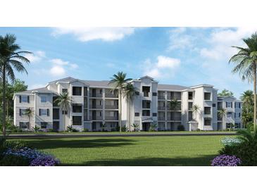 Beautiful three-story building with patios, lush landscaping, and a well-manicured lawn at 17560 Opal Sand Dr # 201, Venice, FL 34293
