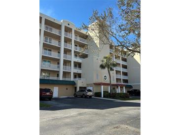 Multi-story condo building with a well-maintained exterior and convenient parking at 6425 Shoreline Dr # 10506, St Petersburg, FL 33708