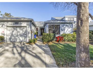 Charming home features a well-manicured lawn, a one-car garage, and a welcoming front entrance at 992 San Carlos Ne Ct, St Petersburg, FL 33702