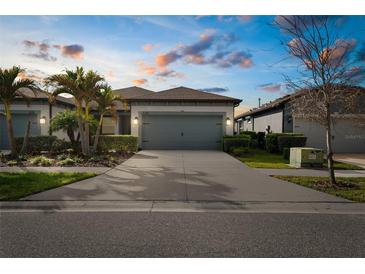 Charming single-Gathering home with a well-manicured lawn and a two-car garage at 6218 Mooring Line Cir, Apollo Beach, FL 33572