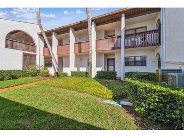 Charming condo building featuring private balconies and well-maintained landscaping at 7623 Radcliffe Cir # 112A, Port Richey, FL 34668