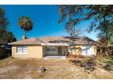 Charming single story home with stucco exterior, well-maintained landscaping, and attached one car garage at 924 N Castle Ct, Tampa, FL 33612