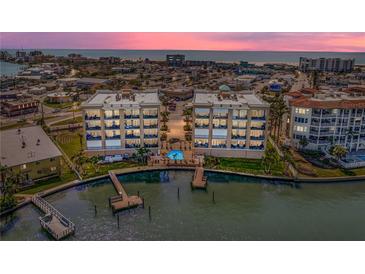 Beautiful waterfront condo buildings with a community pool and dock access to the ocean at 240 108Th Ave # 102, Treasure Island, FL 33706