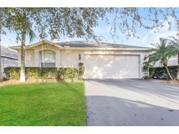 Charming single-story home with a well-manicured lawn and a two-car garage at 29636 Tee Shot Dr, San Antonio, FL 33576