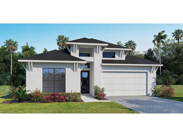 New construction home featuring a modern elevation, two-car garage, and manicured landscaping at 3719 109Th Street East, Palmetto, FL 34221