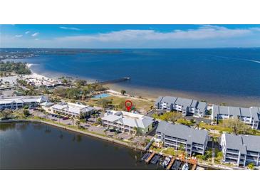 Stunning aerial view of the waterfront condos with easy access to the beach, pier, and boat docks at 611 Destiny Dr # 304, Ruskin, FL 33570