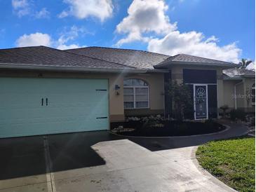 Charming single-story home with a well-manicured lawn and inviting curb appeal at 28 Sportsman Pl, Rotonda West, FL 33947