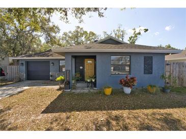 Charming single-story home featuring a cozy front porch and an attached two-car garage at 2332 Seward Dr, Sarasota, FL 34234