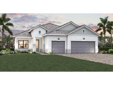 Charming one-story home with a two-car garage, well-manicured lawn, and beautiful landscaping at 17976 Foxtail Loop, Venice, FL 34293