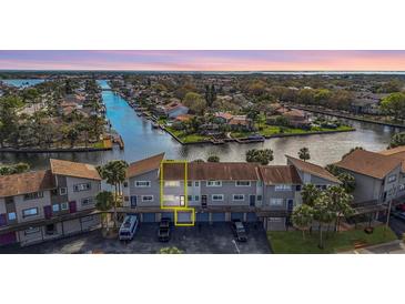 Waterfront townhomes offering stunning canal views and private garages at 6317 Newtown Cir # 17B2, Tampa, FL 33615