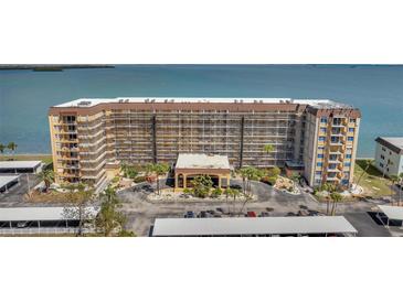 Waterfront condominium complex featuring covered parking and water views at 9 Haig Pl # 310, Dunedin, FL 34698