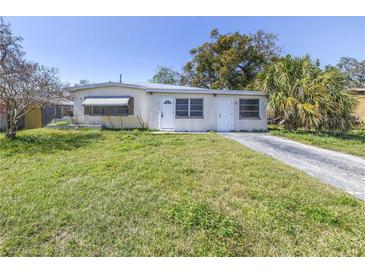 Charming single-story home featuring a well-maintained lawn and a private driveway at 10086 Seminole Blvd, Seminole, FL 33772